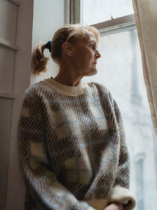 woman with cognitive decline looking out the window