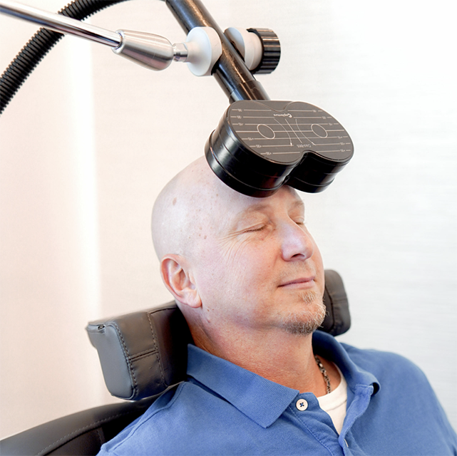 Man receiving TMS treatment for Depression, OCD or Anxiety